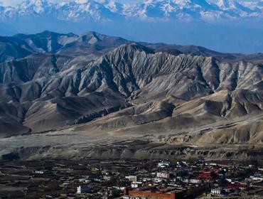 Walled_City_of_Lo_Manthang_with_Layers_of_barren_hills_and_mountains 