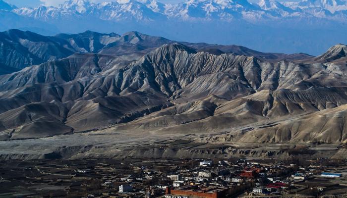 Walled_City_of_Lo_Manthang_with_Layers_of_barren_hills_and_mountains 